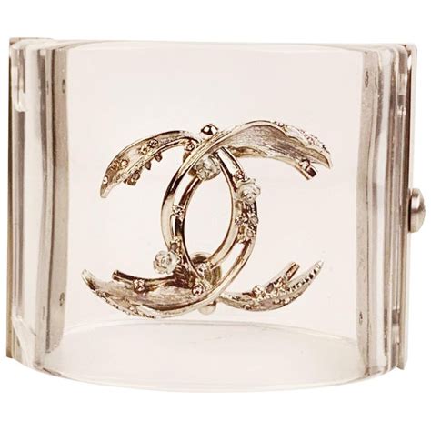 vintage chanel charm|Chanel clear cuff bracelet.